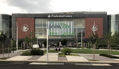 Prudential Center in Newark, NJ, featuring a large digital display and surrounding landscaped area, near Uforia Dispensary for convenient cannabis delivery and pickup options.