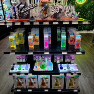 Display of various glass bongs and smoking accessories in a retail setting