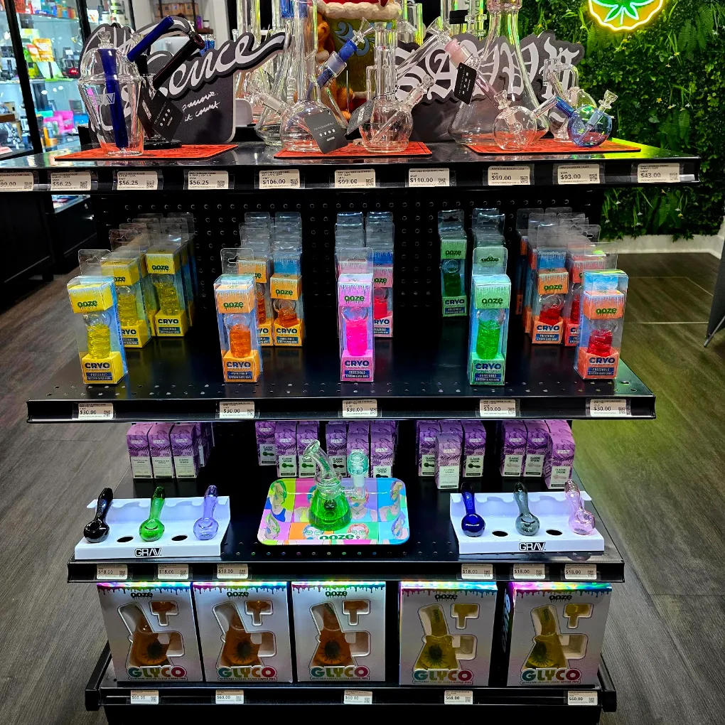Display of various glass bongs and smoking accessories in a retail setting