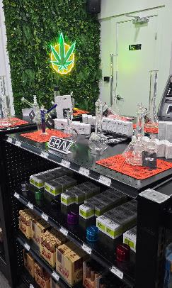 Dispensary staff explaining lab-tested cannabis products to a customer